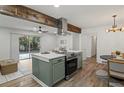 Well-equipped kitchen island features sleek appliances and dining space with bright windows and a sliding glass door at 2378 Green Forrest Dr, Decatur, GA 30032