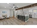 Bright and airy kitchen featuring a large island with barstools and lots of open floorspace at 2378 Green Forrest Dr, Decatur, GA 30032