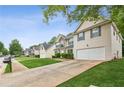 View of a neighborhood street featuring well-maintained homes with manicured lawns and tree-lined sidewalks at 2896 Chilhowee Dr, Atlanta, GA 30331