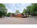 Community brick building featuring well-manicured landscaping and ample parking at 672 Mcgill Ne Pl # 672, Atlanta, GA 30312