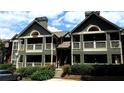 Exterior shot showcasing multi-level architecture with cozy balconies and green landscaping at 672 Mcgill Ne Pl # 672, Atlanta, GA 30312