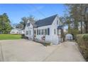 Inviting cottage style home with long drive and meticulous landscaping at 1831 Dresden Dr, Brookhaven, GA 30319