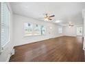 Bright living room with hardwood floors, ceiling fans, and multiple windows at 1831 Dresden Dr, Brookhaven, GA 30319
