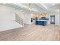 Open floorplan with large living room that opens to a gourmet kitchen and breakfast area at 4377 Hosch Reserve Dr, Buford, GA 30519