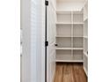 Walk in pantry with custom shelving perfect for organization and storage at 4377 Hosch Reserve Dr, Buford, GA 30519
