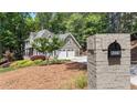 Lovely home with a two-car garage, well-kept landscaping, and a mailbox with house numbers on a brick base at 4320 Oklahoma Nw Way, Kennesaw, GA 30152