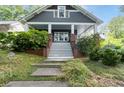 Charming two-story home features a welcoming front porch and landscaped front yard at 1228 Hosea L Williams Ne Dr, Atlanta, GA 30317
