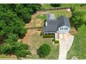 Aerial view of a well-maintained home with a spacious, fenced backyard and lush greenery at 259 Pine Valley Dr, Powder Springs, GA 30127
