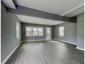 Bright and airy living room featuring hardwood floors, large windows, and neutral wall color at 629 Windsor Sw St, Atlanta, GA 30312