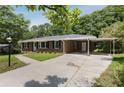 Lovely brick home with a convenient carport and well-maintained driveway, nestled in a serene, tree-filled neighborhood at 174 Zelma Sw St, Marietta, GA 30060