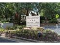 Entrance sign that reads: The Landings Martin Lakes Townhomes & Condominiums at 386 Teal Ct, Roswell, GA 30076