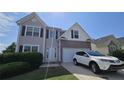 Two-story home features a brick facade, attached garage, and manicured lawn at 771 Franklin Mill Trce, Loganville, GA 30052