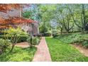 Landscaped brick walkway leading to the side of the townhome in a beautiful garden setting at 1505 September Chase, Decatur, GA 30033