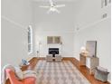 Light and airy living room with hardwood floors, fireplace and neutral decor at 3327 James Harbor Way, Lawrenceville, GA 30044