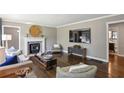 Spacious living room with wood floors, fireplace, television, and neutral decor at 727 Channing Nw Dr, Atlanta, GA 30318