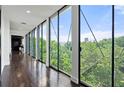 Hallway features floor-to-ceiling windows offering natural light and panoramic views at 130 26Th Nw St # 801, Atlanta, GA 30309