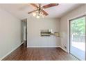 View of the dining room with light walls, ceiling fan, and sliding doors to the deck at 29 Parkwood Ne Dr, Kennesaw, GA 30144