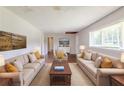 Bright living room furnished with sofas, coffee table, rug and wall art at 29 Parkwood Ne Dr, Kennesaw, GA 30144