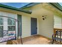Inviting front porch with a cozy porch swing, perfect for relaxing and enjoying the outdoors at 173 Elder Dr, Social Circle, GA 30025