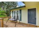 Close-up of front porch with swing, showcasing the home's welcoming entryway and curb appeal at 173 Elder Dr, Social Circle, GA 30025