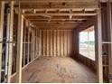 Interior framing of room with window showcasing the construction of new home at 3435 Dr Bramblett Rd, Cumming, GA 30028