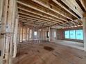Spacious room showing wood framing, plywood sheathing, and the electrical work and plumbing rough-in at 3435 Dr Bramblett Rd, Cumming, GA 30028
