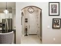 Inviting entryway with tile floors, art decorations, and a view into the kitchen area at 3621 Vinings Slope Se # 1231, Atlanta, GA 30339