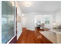 Bright entryway with hardwood floors, leading to the living and dining areas at 1955 Piedmont Cove Ln, Cumming, GA 30040