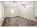 Bright living room featuring hardwood floors, a ceiling fan, and large windows at 3242 College St, Atlanta, GA 30337