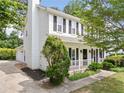 Two-story home featuring a well-manicured front yard and inviting front porch at 3405 Haverhill Rowe, Lawrenceville, GA 30044