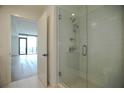 Bathroom boasts a tiled shower with glass doors next to the bedroom's door entrance at 788 W Marietta Nw St # 811, Atlanta, GA 30318