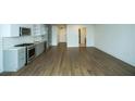 Open-concept layout showcases a kitchen with stainless appliances and light gray cabinets at 788 W Marietta Nw St # 811, Atlanta, GA 30318