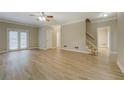 Large living room featuring new wood floors and access to the outside deck at 1201 Justin Ln, Lithonia, GA 30058