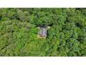 Secluded home nestled amongst mature trees at 150 Gill Ln, Stockbridge, GA 30281