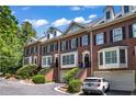 Attractive brick townhomes with manicured landscaping, private entries, and garage parking at 1735 Peachtree Ne St # 624, Atlanta, GA 30309