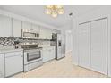 Bright kitchen features stainless appliances and a pantry/closet for extra storage at 2858 Spring Villa Se Ln, Smyrna, GA 30080