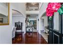 Grand foyer with gleaming hardwood floors and an open staircase, creating an inviting entrance at 7115 Secret Rose, Douglasville, GA 30134