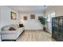 Comfortable living room with neutral tones, stylish flooring, and ample natural light, perfect for relaxation at 7115 Secret Rose, Douglasville, GA 30134