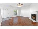 Inviting living room featuring a fireplace, hardwood floors, and ample natural light at 3468 Washington Way, Doraville, GA 30340