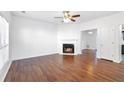 Spacious living room featuring hardwood floors, fireplace, and abundant natural light at 3468 Washington Way, Doraville, GA 30340