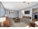 Open-concept living room with a comfortable sofa, media center and a view of the kitchen at 1151 Rankin St # 20A, Stone Mountain, GA 30083