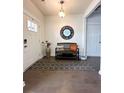 An inviting foyer with hardwood floors, bench seating, and a decorative mirror at 2706 Park Land Ln, Snellville, GA 30078