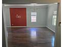 Spacious living room with shiny hardwood floors and modern lighting at 112 Brown Se Ave, Atlanta, GA 30315