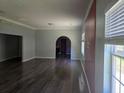 Bright living room featuring an archway and unique red accent wall at 112 Brown Se Ave, Atlanta, GA 30315