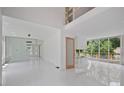 Bright open living area with large windows, gleaming floors, and access to outdoor deck at 1410 Lavista Ne Rd, Atlanta, GA 30324