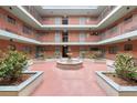 Open-air courtyard featuring a central fountain, landscaping and decorative brickwork at 91 Rumson Rd, Atlanta, GA 30305