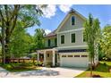 Charming two-story home features a well-kept lawn, with fresh landscaping, and a two car garage at 138 Beutell St, Norcross, GA 30071