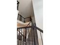Staircase featuring railings and hardwood floors at 1932 River Crest Way, Lawrenceville, GA 30045