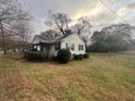 Quaint one-story bungalow with a tidy front yard and classic architectural details at 5111 Newark Ave, Clarkdale, GA 30111