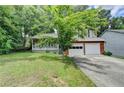 Charming two-story home featuring a covered porch and a traditional brick and siding exterior at 2121 Crescentview Dr, Lawrenceville, GA 30044